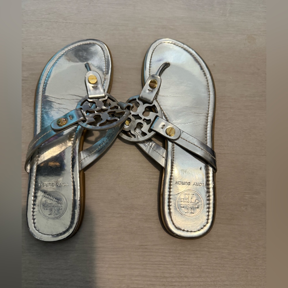 Tory Burch silver sandals.
